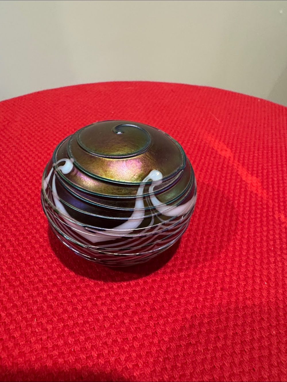 Iridescent Green-Bronze Glass Orb with White Swirl Accent